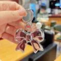 Korean sweet silver bow keychain with pearl pendant, exquisite metal bag pendant accessory. - Silver