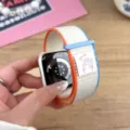 Detailed close-up of nylon loop watch strap featuring cute bunny woven tag and Velcro closure. - 44/45/46/49MM Universal / Milky White (Rabbit)