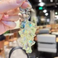 Detail shot of the iridescent lily of the valley flower keychain pendant, shiny crystal style. - Transparent Lily of the Valley String - Yellow
