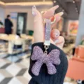 Crystal rhinestone bow keychain, luxury purple bag charm and stylish car key ring for women. - Purple