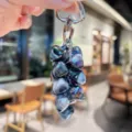Crystal strawberry keychain detail, shiny iridescent bead cluster with silver heart clasp. - Colorful Heart String - Black