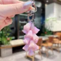Pink holographic lily of the valley keychain detail shot, cute bag charm pendant accessory. - Colorful Lily of the Valley String - Light Pink