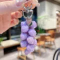 Detailed view of the colorful rose grape cluster keychain pendant with shimmering purple beads. - Colorful Rose String - Purple