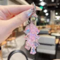 Pink iridescent lily of the valley flower pendant keychain for stylish women bag decoration. - Transparent Lily of the Valley String - Pink