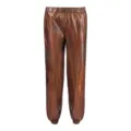 Glossy metallic trousers detail, shiny iridescent fabric, elastic waist streetwear pants. - Holographic Coffee