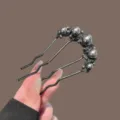 Black pearl U-shaped hair fork dark metal hair comb variant for elegant bun hairstyling. - 5-Pearl Wave Rhinestone Hairpin / Gunmetal