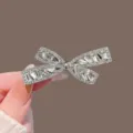 Korean sweet rhinestone bow hair clip for women, luxury sparkling hair accessory for styling. - Silver