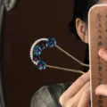Exquisite Chinese style U-shaped hairpin detail shot featuring elegant blue floral pearls. - Blue Flower Hairpin