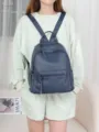 Leather backpack detail view, casual multi-pocket design, stylish daily travel bag accessory. - Denim Blue