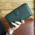 Green long leather wallet for women, minimalist design with zipper and snap closure. - Green