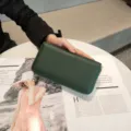 Dark green genuine leather long wallet detail shot, elegant pebble grain texture and zipper. - 19*10cm / Green