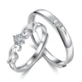 Adjustable silver couple rings set with sparkling cubic zirconia and sweet angel wing design. - Angel Wings Pair Rings