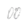 Silver couple rings set with Mobius twist design and sparkling solitaire four prong diamond. - Frosted Four-Prong Couple Rings