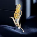 Gold tone wheat ear brooch featuring yellow rhinestones, clear crystals and a white pearl. - Wheat Ear Flower (4073061)