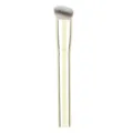 Angled makeup brush with soft bristles and gold handle for precise liquid foundation application. - Gold