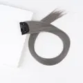 Grey clip-in hair extension detail view showing smooth straight synthetic hair with secure snap clip. - Ash Grey