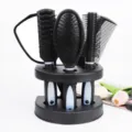 Detailed view of black hair brush set showcasing multi-functional combs and stand organizer. - Blue