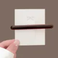 Acetate hair clip for women, glossy brown long barrette, chic baguette hair accessory style. - Coffee