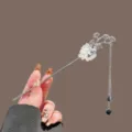 New Chinese style metal hair stick with white floral and black tassel beads for elegant buns. - Silver Ink Pine Needle Tassel Hair Stick