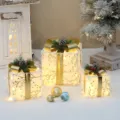 Weihnachtliche leuchtende Geschenkboxen 3er-Set mit warmem Licht und goldenen Schleifen als Deko. - Dreiteiliges Set / Mit Licht (3er-Pack)