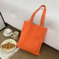 Oranger Segeltuch Shopper mit doppelten Henkeln, ästhetische Freizeittasche für den Alltag. - Orange