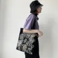 Details of black canvas tote bag with cute bear print, stylish daily shoulder bag for women. - Tie Bear Black