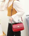 Red genuine leather crossbody handbag with top handle and metal lock for women stylish daily use. - Burgundy