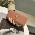 Genuine leather long wallet for women, textured finish with metal clasp closure detail. - Pink