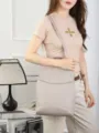 Detailed view of genuine leather convertible backpack in light grey, soft texture, elegant design. - Off White