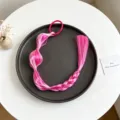 Dettaglio parrucca coda di cavallo con treccia a bolle colorata, elegante capello sintetico. - modello 3