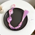 Dettaglio ravvicinato dell'accessorio per capelli sintetici con treccia a bolle sfumata. - Stile 5