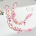 Detailed view of sweet pink gradient synthetic hair braid with cute flowers and butterflies. - Pink Butterfly Bubble Braids One Pair
