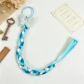 Kids synthetic blue braided hair extension with cute bow tie hair accessory detail view. - Style 4