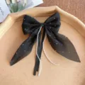 Elegant black bow hair clip with sparkling rhinestones and hanging pearl chains for women. - Black