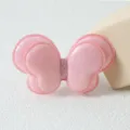 Vue détaillée de la pince à cheveux papillon double à paillettes roses pour coiffures mignonnes. - Pince à Cheveux Rose