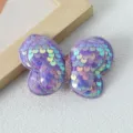 Close-up of purple sequin butterfly hair clip accessory, sparkling design for nice hair styling. - Purple Hair Clip