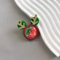Christmas glitter deer antler hair clip close-up, red and green festive hair accessories detail. - Green Hair Clip