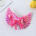 Close-up shot of the cute pink sequin unicorn hair clip with shiny angel wings detail. - Rose Red Hair Clip