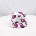 Detailed view of white bucket hat featuring funny cartoon eggplant print pattern closeup. - Eggplant White