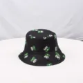 Detailed close-up view of the black printed bucket hat featuring cute cartoon frog pattern. - One Size (55-58cm) / Style 1