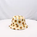 Detailed close-up view of the sunflower printed pattern on the white cotton bucket hat fabric. - M (56-58cm) / White