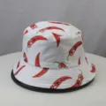 Detail view of white bucket hat featuring cute cartoon red chili pepper print design. - One Size / White Chili