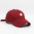 Burgundy baseball cap with white embroidered letters, casual cotton sun hat for outdoor wear. - Burgundy