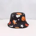 Detailed close-up shot of the black Halloween print bucket hat featuring cute pumpkin patterns. - Black