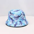 Blue dolphin print bucket hat detail, summer sun protection casual hat close up view - One Size / Sky Blue