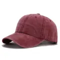 Detail view of a washed retro maroon baseball cap, distressed cotton dad hat for outdoor sun protection. - Burgundy