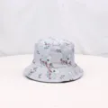Close-up detail of grey bucket hat with cute koala print, soft summer sun protection fabric. - Gray