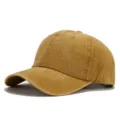 Close-up of the vintage washed denim baseball cap showcasing distressed texture and fine stitching. - Turmeric