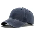 Washed denim vintage baseball cap detail showing distressed texture and curved brim style - Navy Blue