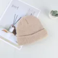 Solid color knitted beanie hat for men and women, stylish winter warm fisherman cap. - One Size / Off White